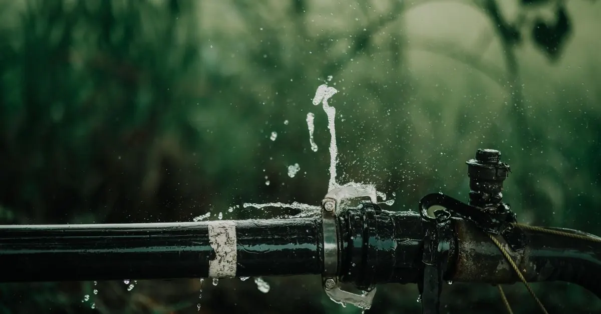Water spraying from a split water pipe